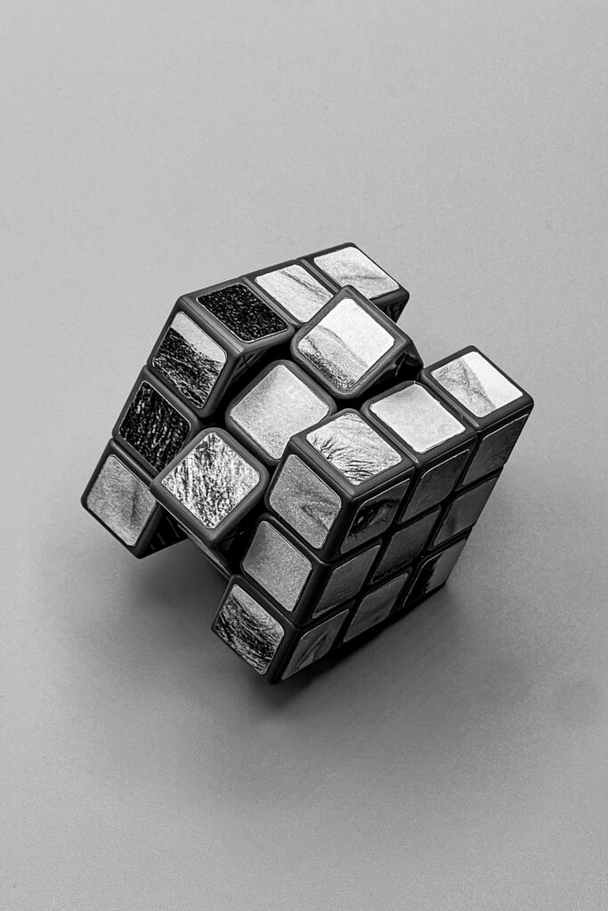 A Rubix cube with pencil drawings on each side